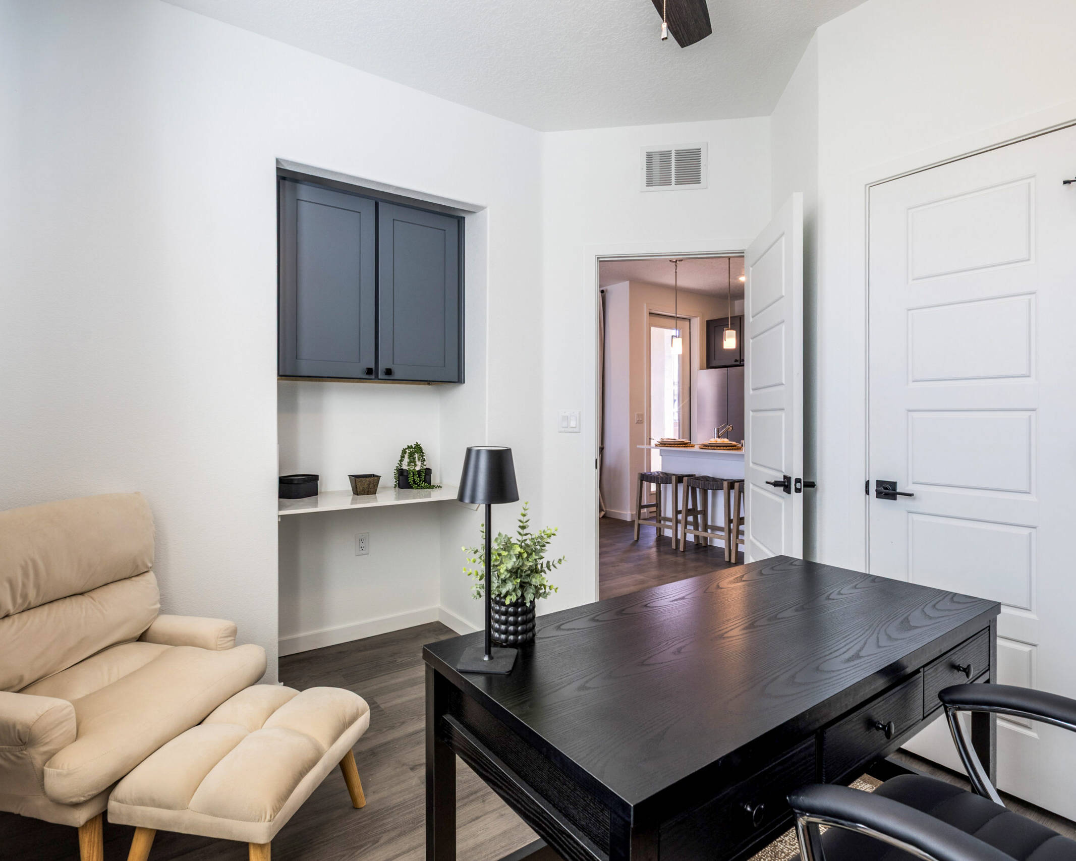 in-unit modern office with a mounted cabinet, and closet space.