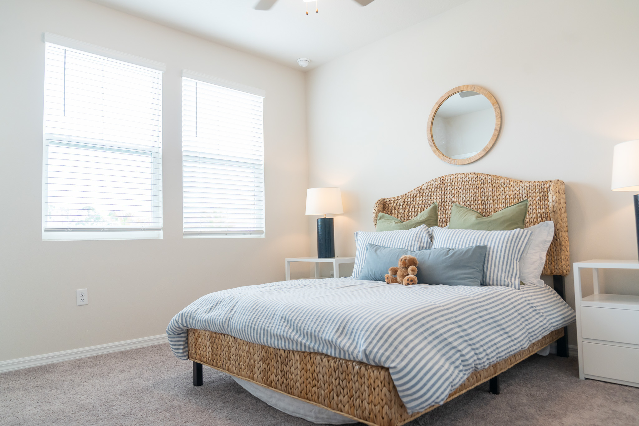brightly lit bedroom with coastal theme