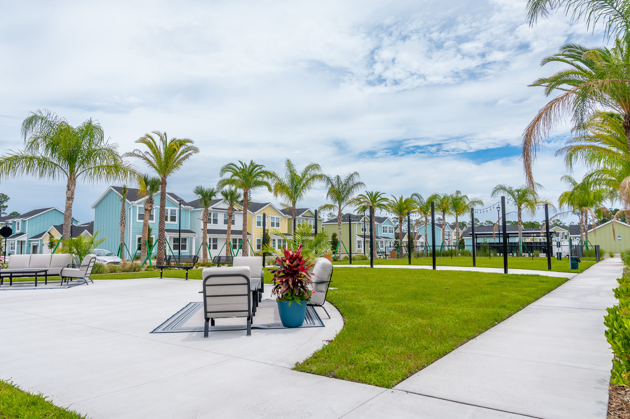 outdoor seating area under florida palm trees